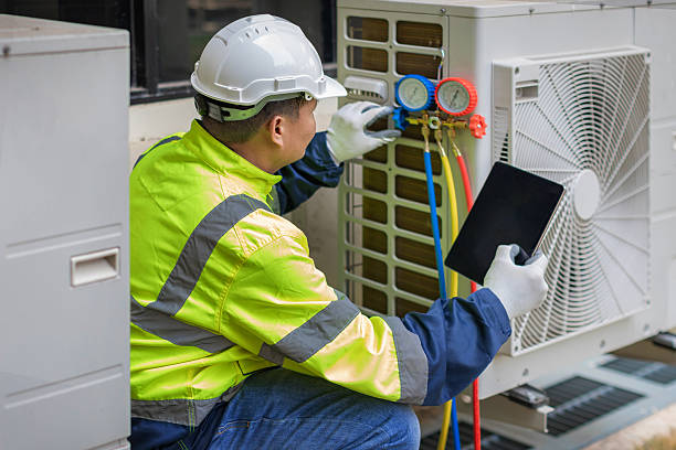 Professional Heat Pump Repair technician working in Jamesport, NY